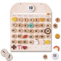 a wooden calendar with buttons and magnets on it