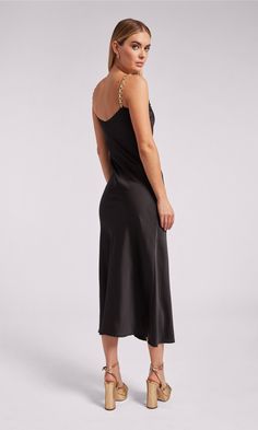 Go for a wow moment with the Monica. Crafted with soft satin in a maxi silhouette, this flowy dress features sleek chain straps that give it the perfect edge. Style with heels and gold jewelry and you'll be the best dressed guest at your next wedding or cocktail party. Product Fit & Details 100% Polyester Professional dry clean True to Size Style: SP24666-1 Model Size & FitModel wears a size XSModel wears: UK 6/ EU 34/ US 2Model's height: 177cm/5'10” Black Silk Satin Maxi Dress, Black Satin Maxi Dress With Satin Finish, Black Satin Finish Modal Dress, Black Satin Finish Maxi Dress, Luxury Black Satin Finish Slip Dress, Satin Maxi, Satin Maxi Dress, Flowy Dress, Cocktail Party