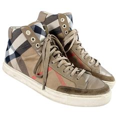 BURBERRY sneakers in a beige and black canvas featuring signature Burberry check pattern, high top style, and lace-up closure. Made in Spainches Very Good Pre-Owned Condition. Moderate signs of wear. Marked: ESSUSSHO18ELD 41Outsole: 11 inches x 4 inches Sui Generis Reference: 132602 Category: Sneakers More Details Brand: BURBERRY Gender: Male Size: 8 Color: Beige Color 2: Black Pattern: Plaid Fabric: Canvas Type of Leather: Leather Style: High Top Made in: Spain Age Group: Adult Burberry Plaid Print, Canvas High Top Sneakers, Burberry Sneakers, Rick Owens Sneakers, Red Studs, Balenciaga Speed, Fabric Canvas, Beige And Black, Leather High Tops