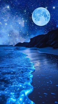 the beach is covered in blue water and stars above it, while the moon shines brightly