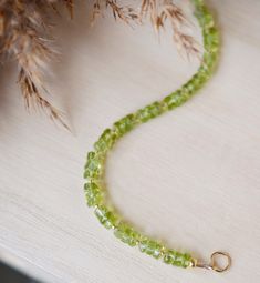 Associated with the sun, Peridot is believed to drive away dark feelings and inspire happiness! This bracelet is made with natural semi-round "wheel" shape peridot gems dotted with gold or silver beads. Wear this bracelet singly or stack it with others. Or give it to your favorite August birthday friend! STONE SIZE: 5mm (.19") Peridot Gemstone Beads Jewelry, Green Gemstone Rondelle Beaded Bracelets, Handmade Lime Green Peridot Jewelry, Green Peridot Bohemian Jewelry, Green Bohemian Peridot Jewelry, Bohemian Green Peridot Jewelry, Adjustable Peridot Bracelet, Green Peridot Jewelry With Gemstone Beads, Green Peridot Gemstone Beads Jewelry