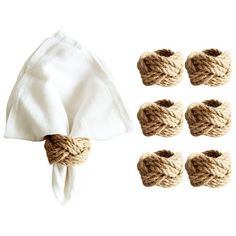 six pieces of rope tied to napkins and two white napkins on top of each other