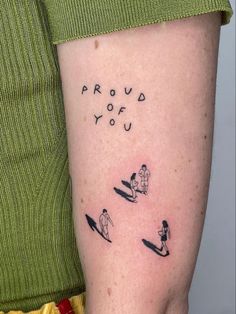 a woman with a tattoo on her arm that says proud to you and three surfers