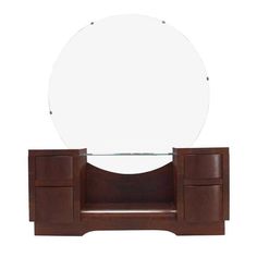 a mirror sitting on top of a wooden cabinet