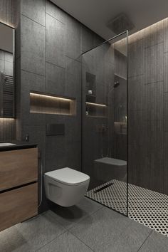 a bathroom with a toilet, sink and shower stall in the middle of the room