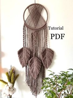 a wall hanging made out of macrame yarn