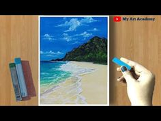 someone is drawing a beach scene with colored pencils and watercolor paints on paper