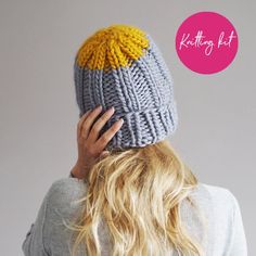 a woman with blonde hair wearing a knitted hat