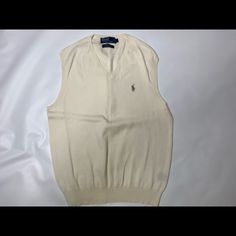 Polo Ralph Lauren Sweater Vest Cream Large. Never Worn Classic Cotton Crew Neck Sweater Vest, White Fitted Crew Neck Sweater Vest, Classic Sleeveless Sweater For Spring, Classic Cream Sleeveless Top, Classic Sleeveless Spring Sweater, Classic Sleeveless Cream Top, White Fitted Classic Sweater Vest, White Crew Neck Vest For Fall, Classic White V-neck Sweater Vest