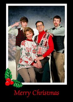 a group of people standing next to each other in front of a merry christmas card