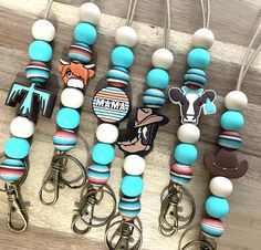 several key chains with different designs on them