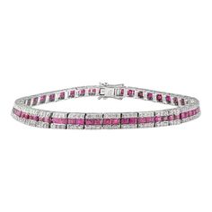 This is part of Chairish’s Fine Jewelry assortment.  This Art Deco Style Ruby and Diamond Wedding Tennis Bracelet in 18K gold showcases 6.41 carats endlessly sparkling natural ruby and diamonds. It measures 7 inches long in length.  Ruby improves mental strength.  Designed with perfect square cut ruby set in center with diamonds set on top and bottom of the ruby to make you stand out on any occasion or event. The elegant style complements the attire beautifully and is a perfect Engagement Gift, Perfect Engagement Gifts, Ruby Set, Bracelet Tennis, Perfect Squares, Mother Daughter Gifts, Garnet Bracelet, Mental Strength, Birthstone Bracelets, Thanksgiving Gift