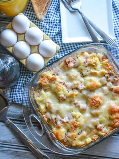 a casserole dish with meat and eggs in it on a blue checkered table cloth