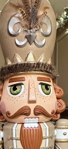 a nutcracker with a crown on top of it's head and eyes