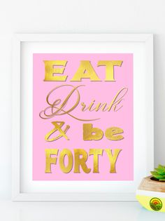 a pink and gold poster with the words eat drink and be sixty written in gold