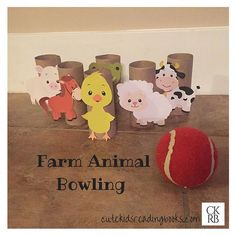 farm animal bowling game on the floor with paper animals