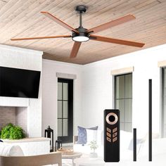 a living room with white walls and ceiling fan