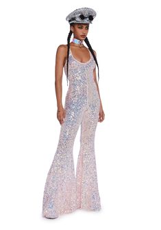 cuz you’ve got them mesmerized. This jumpsuit has a stretchy sequin construction, flare pants, an open back, and cross straps. Sequin Backless Jumpsuits And Rompers For Party Season, Sequin Backless Jumpsuits And Rompers For Night Out, Glamorous Stretch Sequin Jumpsuits And Rompers, Glamorous Backless Jumpsuits For Night Out, Sequin Stretch Jumpsuits And Rompers For Party Season, Sleeveless Disco Jumpsuit For Night Out, Fitted Sequin Disco Jumpsuits And Rompers, Fitted Disco Jumpsuits And Rompers With Sequins, Glamorous Stretch Jumpsuit For Party