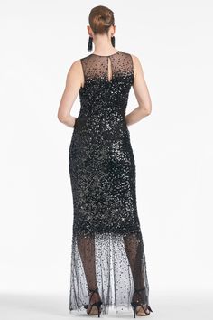 Adorned with black shimmering sequins, the Candice gown exudes elegance and sophistication. Its unique fade effect with hand-placed embellishment and tulle at both ends make her a true work of art. Showstopping, put simply.Details:Model is 5'9" wearing size 2Full-Length, 60" from top of shoulder to bottom hemBack Zipper & Hook and Eye ClosureScatter Sequins & Tulle95% Polyester, 5% SpandexImportedStyle #F242G14-001 Sachin And Babi, Embroidery Business, Fashion Institute Of Technology, Deco Dress, Sachin Babi, Art Deco Dress, Full Length Gowns, Fashion Institute, Column Gown