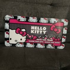 a hello kitty card sitting on top of a couch