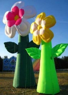 inflatable flower vases are on the ground