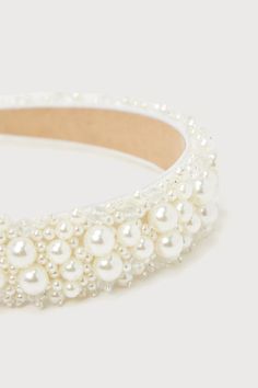 The Lulus Immaculate Icon Ivory Pearl Beaded Headband is an extra special way to create a look that everyone will love! This ultra-glamorous headband features a wide silhouette, embellished with varying sizes of gleaming faux pearls and shiny clear beaded details that create a luminous design throughout. Measure 13. 25'' from end to end. 1'' wide. 80% Plastic, 15% Polyester, 3% Glass. Imported. Lulus | Immaculate Icon Ivory Pearl Beaded Headband. Beaded Hair Accessories For Wedding, White Beaded Headband Jewelry, Adjustable White Beaded Headpiece, White Evening Headband, Cute Hair Accessories, Lulu Fashion, Beaded Headband, Cute Hair, Ivory Pearl