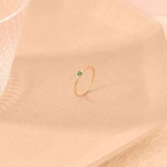 Elevate your style with this Emerald Minimal Solitaire Ring by Lucy Jewelry. Crafted in 14k solid gold, it features a dainty twisted band that leads to a brilliant emerald solitaire. This ring exudes elegance and sophistication, making it an ideal choice for a promise ring, engagement ring, or a unique addition to your jewelry collection. The ring can be made with yellow, rose, or white gold, please choose your size from the dropdown menu options above. 𝐑𝐢𝐧𝐠 𝐃𝐞𝐭𝐚𝐢𝐥𝐬 ❥ Solid gold, avai Proposal Ring Gold, Minimal Diamond Ring, Dainty Promise Ring, Tiny Diamond Ring, Gold Emerald Ring, Diamond Alternative Engagement Ring, Green Stone Ring, Twisted Band Ring, Dainty Wedding Ring