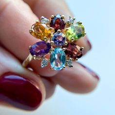 Multi Gemstone and Diamond Flower Vintage Ring 14K Yellow Gold Aquamarine Garnet Citrine Amethyst all the gemstones are 6x4mm Diamond 1.5mm 3.9gm Size 6 Thank you for visiting our shop! 𝑫𝑴𝑲 𝑱𝒆𝒘𝒆𝒍𝒓𝒚 Each order will be beautifully packaged Our jewelry is 100% Authentic Please feel free to look at the other items I hope you will find something else that will like and interest you. EVERY DAY JEWELRY!!! Perfect gift for any occasion. Fine Jewelry Flower Cluster Ring With Gemstone, Multicolor Oval Amethyst Ring, Multicolor Oval Amethyst Gemstone Ring, Oval Multi-stone Flower Ring Gift, Oval Multi-stone Flower Ring For Anniversary, Flower Vintage, Diamond Flower, Vintage Ring, Multi Stone