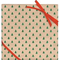 a wrapping paper with christmas trees on it and a red ribbon tied around the edges