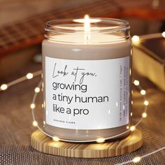 a candle that says, look at you growing a tiny human like a pro