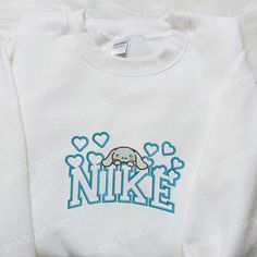 Cinnamoroll Hearts x Nike Embroidered Shirt, Cartoon Embroidered Hoodie, Valentine Gift Idea Welcome to Tinicloset, where every stitch tells a story and every garment is a canvas for creativity and cuteness. Nestled amidst a kaleidoscope of embroidered wonders, Tinicloset is a whimsical wonderland where fashion fantasies come to life. Step into our enchanting world, where custom embroidered shirts, sweatshirts, T-shirts, and hoodies are more than just apparel; they’re adorable expressions Cute Cotton Sweatshirt With Embroidered Logo, Cute Cotton Sweatshirt With Custom Embroidery, Cute Winter Hoodie With Embroidered Graphics, Casual White Sweatshirt With Machine Embroidery, Cute Hoodie With Custom Embroidery For Winter, Cute Hooded Sweatshirt With Embroidered Graphics, Cute Embroidered Graphics Hoodie For Winter, Cute Embroidered Long Sleeve Hoodie, Cute Custom Embroidery Sweatshirt For Winter