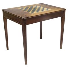 a small wooden table with a checkerboard design on the top and bottom edge