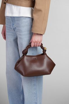 STYLE SPOTLIGHT: CHIC IN CHOCOLATE Introducing the Ganni Small Bou Handbag in rich, decadent brown—a handbag that’s as sweet as it sounds. With its signature twisted handle and modern silhouette, this accessory is perfect for day-to-night transitions, it’s versatile enough to pair with anything from tailored blazers to casual weekend wear. Shop this stunner on italist. Click the link. #GanniBag #LuxuryFashion #HandbagGoals #ItalistFinds #DesignerStyle #FashionLovers #ChicInBrown Brown Handheld Shoulder Bag With Dust Bag, Handheld Leather Pouch With Dust Bag, Handheld Leather Pouch With Dust Bag Included, Daily Use Pouch With Top Carry Handle, Brown Top Handle Pouch For Shopping, Designer Brown Top Handle Clutch, Brown Handheld Pouch With Detachable Strap, Brown Pouch With Detachable Handle, Brown Shoulder Bag Pouch With Detachable Handle