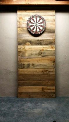 a dart board mounted to the side of a wall