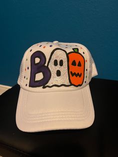 Halloween BOO painted trucker hat!  Custom colors and designs available. Message me for info! White Halloween Cap, White Novelty Hat For Halloween, Casual Halloween Trucker Hat Baseball Cap, Casual Halloween Trucker Hat, Casual Snapback Trucker Hat For Halloween, Casual Halloween Baseball Cap, Painted Trucker Hats, Painted Apparel, Halloween Ball