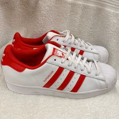 Nwt Adidas Superstar Shoes Originals Sneakers Cloud White And Vivid Red - Size 9. New Without Box But With Tag. Please Note There Are A Few Marks On Them From Being Stored Away. Never Worn. Very Nice. This Item Is Kept In A Smoke And Pet Free Environment. Sporty Slip-on Skate Shoes With Red Sole, Red Low-top Skate Shoes With Laces, Red Lace-up Adidas Logo Sneakers, Red Adidas Low-top Sneakers, Red Low-top Adidas Sneakers, Sporty Red Slip-on Skate Shoes, Red Slip-on Sporty Skate Shoes, Red Slip-on Skate Shoes, Adidas Sneakers In University Red With Red Sole