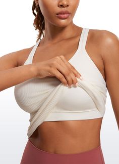 Seamless collection of smooth, breathable fabric is designed to help reduce chafing, encourage ventilation and wick away sweat to help you stay dry. Y-back and scoop neck gives you a stylish look. Built in shelf bra with removable pads provides extra support. Feature & Fitting: 
 Seamless collection 
 Design for yoga 
 Y-back 
 Built in bra & removable pads 
 Fabric: 
 Chafe-free, seamless construction 
 Sweat-wicking, soft ribbed textured fabric 
 Lightweight and stretchy 
 Body: 100% P Functional Stretch Tank Top With Seamless Design, Seamless Stretch Activewear For Relaxation, Versatile Solid Color Sports Bra With Scoop Neck, Sporty Seamless Tops For Relaxation, Versatile Scoop Neck Sports Bra, Functional Sports Bra With 4-way Stretch And Scoop Neck, Comfortable Seamless Activewear, Supportive Breathable Tops For Light Exercise, High Stretch Seamless Fabric Tank Top With Breathable Feature