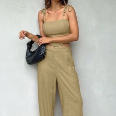 Size(cm) Bust Top Length Waist Hip Pants Length S 75 30 64 94 110 M 79 31 68 98 111 L 83 32 72 102 112 Stay cool and stylish this summer with our women's casual solid color spaghetti strap crop top and long pants set. Made from a soft and skin-friendly blend of 97% polyester and 3% spandex, this two-piece outfit offers a comfortable and breathable fit. The sexy spaghetti strap crop top pairs effortlessly with the high-waisted long pants, creating a chic and relaxed look. Ideal for daily wear, co Chic Summer Sets With Ankle-length Pants, Casual Summer Sets With Straight Pants, Summer Wide Leg Sets With Pockets, Beige Summer Sets With Pockets, Summer Beige Sets With Pockets, Solid Color Trousers Sets For Spring, Summer Solid Color High-waisted Pants Set, Solid High-waisted Pants Sets For Summer, Solid Color High-waisted Pants Set For Summer