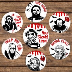 six halloween themed stickers on a wooden surface