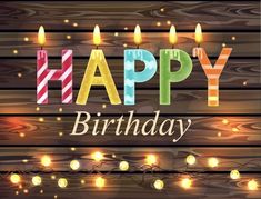 happy birthday card with candles on wooden background