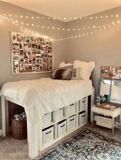 a white bed sitting in a bedroom next to a dresser