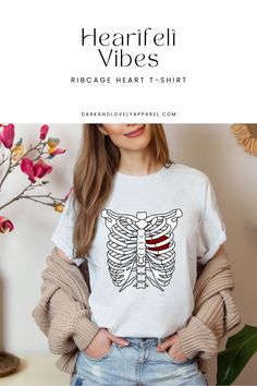 Upgrade your Valentine's Day look with our ribcage drawing graphic t-shirt! 🖤💖 Featuring a cute design showcasing a heart, it adds an edgy flair to your outfit. Crafted for comfort and fashion, our graphic tees are a seasonal staple! 🌟 Don't miss out! #GraphicTees #ValentinesDay #RibcageDrawing #CuteGraphicTees #TShirtsForWomen #OutfitInspiration