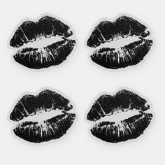 four stickers with black lipstick on them