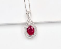 925 Sterling Silver, Natural Red Ruby Cut Pendant Necklace, Solitaire Pendant, Charm Pendant, July Birthstone, Wedding Pendant, Gif For Her. ►Made of solid sterling silver with a rhodium finish (925) ● Code --- PD-181 ● Main Stone --- Natural Ruby ● Birthstone Month --- July ● Color --- Red ● Gem Size --- 8x10 MM ● Carat Weight --- 3.15 ct. (approx.) ● Total Weight --- 5.77 Gram ● Gemstone Creation --- 100% Natural ● Accented Stone --- White Topaz ● Pendant Length --- 0.55 Inch  ● Pendant  Width --- 1.25 Inch  Some of the amazing additional features of this product: ● Fine, professional cut natural gemstones - not synthetic, lab created, nor simulated ● Elegant, makes beautiful engagement gift; anniversary gift; bridesmaid gift; gift for girlfriend; gifts for mom; gift for fiancée ● Suitab Red Gemstone Necklace For Wedding, Lab-created Ruby Necklaces For Wedding, Red Oval Necklaces For Wedding, Wedding Fine Jewelry Necklace With Lab-created Ruby, Fine Jewelry Wedding Necklace With Lab-created Ruby, Red Birthstone Pendant Necklace, Fine Jewelry Lab-created Ruby Necklaces For Wedding, Fine Jewelry Lab-created Ruby Necklace For Wedding, Red Round Pendant Birthstone Necklace