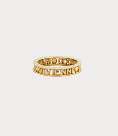 The Vivienne Westwood Westminster ring is named after the esteemed Westminster district in London, renowned for its rich history and cultural importance. The piece receives a silhouette crafted from recycled silver, adorned with a gold-tone finish that elegantly encircles the slim lettering logo on the band. Vivienne Westwood Ring Gold, Gold Vivienne Westwood, Vivienne Westwood Ring, The Vivienne, Ringe Gold, Lettering Logo, Men Trousers, Backpack Travel Bag, Silhouette Crafts