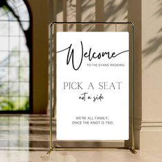 a welcome sign is shown in front of a door with the words, pick a seat not a side