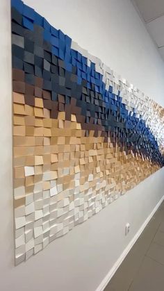 a wall with many different colored squares on it