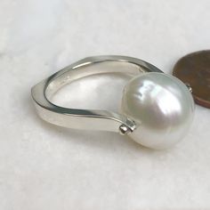 14KT White Gold 12mm Paspaley South Sea Pearl Modern Ring - Legacy Saint Jewelry Modern Pearl Ring With Polished Finish As Gift, Modern Pearl Ring With Polished Finish For Gift, White Gold Sterling Silver Pearl Ring With Polished Finish, White Gold Polished Pearl Ring In Sterling Silver, White Sterling Silver Pearl Ring With Polished Finish, White Pearl Ring With Polished Sterling Silver, Modern White Gold Pearl Ring With Polished Finish, Modern White Gold Sterling Silver Pearl Ring, Modern White Pearl Ring With Polished Finish