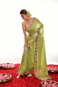 This elegant saree features a light green satin fabric and a stunningly hand-embroidered scalloped border. The gota patti design provides texture and dimension, making this saree a perfect choice for special occasions. Cheap Pista Green Saree For Diwali, Luxury Jamawar Saree With Embroidered Border, Affordable Traditional Pista Green Saree, Cheap Bollywood Style Pista Green Saree, Cheap Green Traditional Saree, Keyah Label Sarees, Cheap Summer Saree, Light Green Saree Look, Traditional Look In Saree