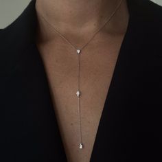 Three 0.25ct diamonds are strung along a 18k gold chain. Diamond shapes from top to bottom are: Round, Marquise, Pear. The collar of the necklace measures 16 inches (40cm); the length of the drop is 4 inches (10cm). To customize, please write to our Atelier. 18k White Gold shown here. Pair with the matching earrings in the Lariat collection. Affordable Adjustable White Long Necklace, Luxury Long Drop Diamond Necklace With Adjustable Chain, Luxury Delicate Long Drop Lariat Necklace, Luxury Women's Lariat Necklace With Delicate Chain, Luxury Brilliant Cut Lariat Necklace For Wedding, Drop Chain Necklace, Luxury Diamond Necklace With Long Drop And Adjustable Chain, Luxury Drop Necklace With Delicate Chain, Long Drop Diamond Necklace